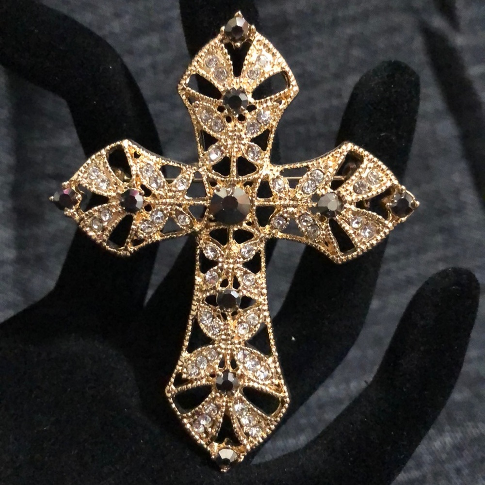 A gold and crystal Cross pin